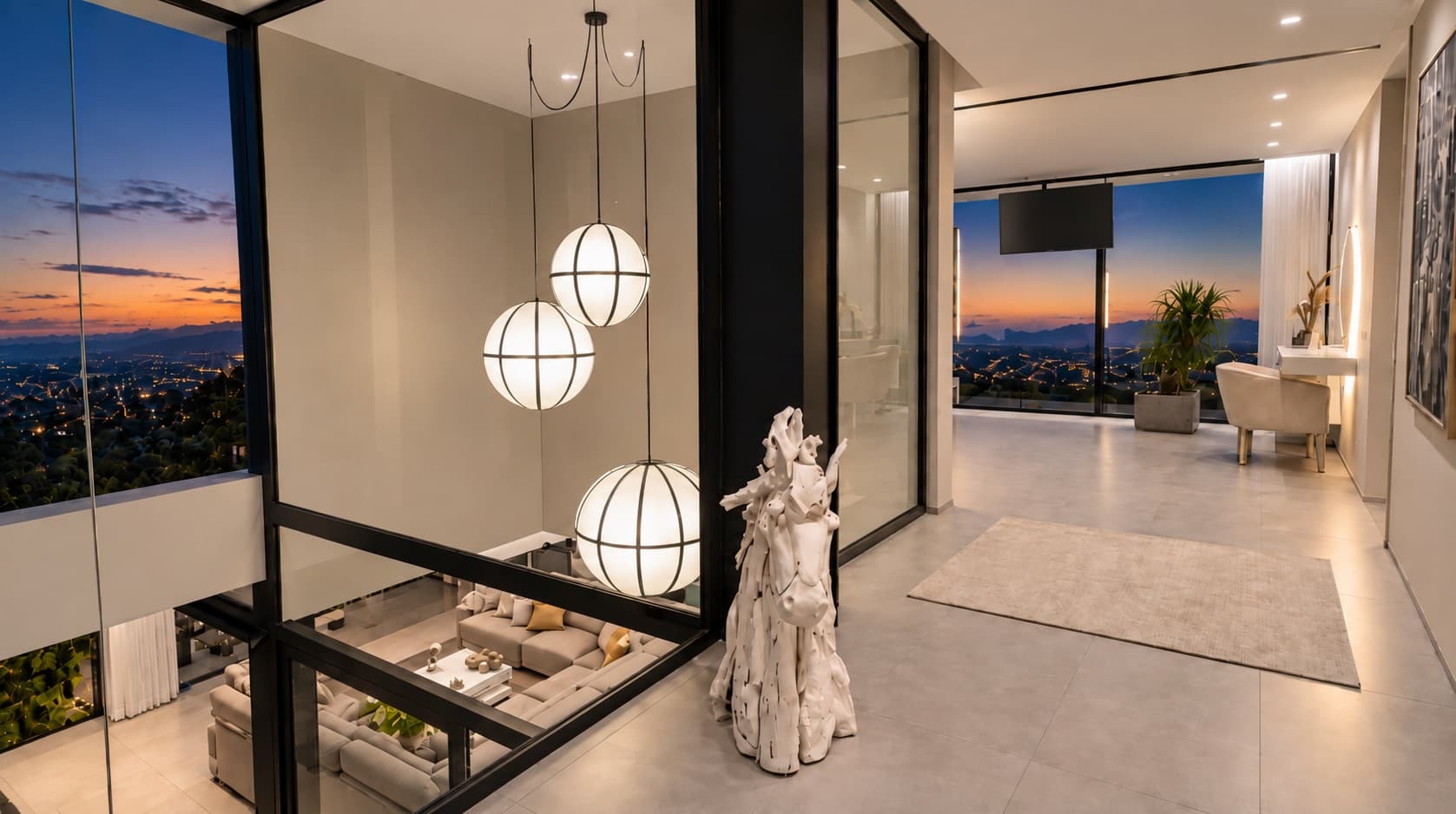 Entrance hall to the suite with spherical lamps and windows at sunset