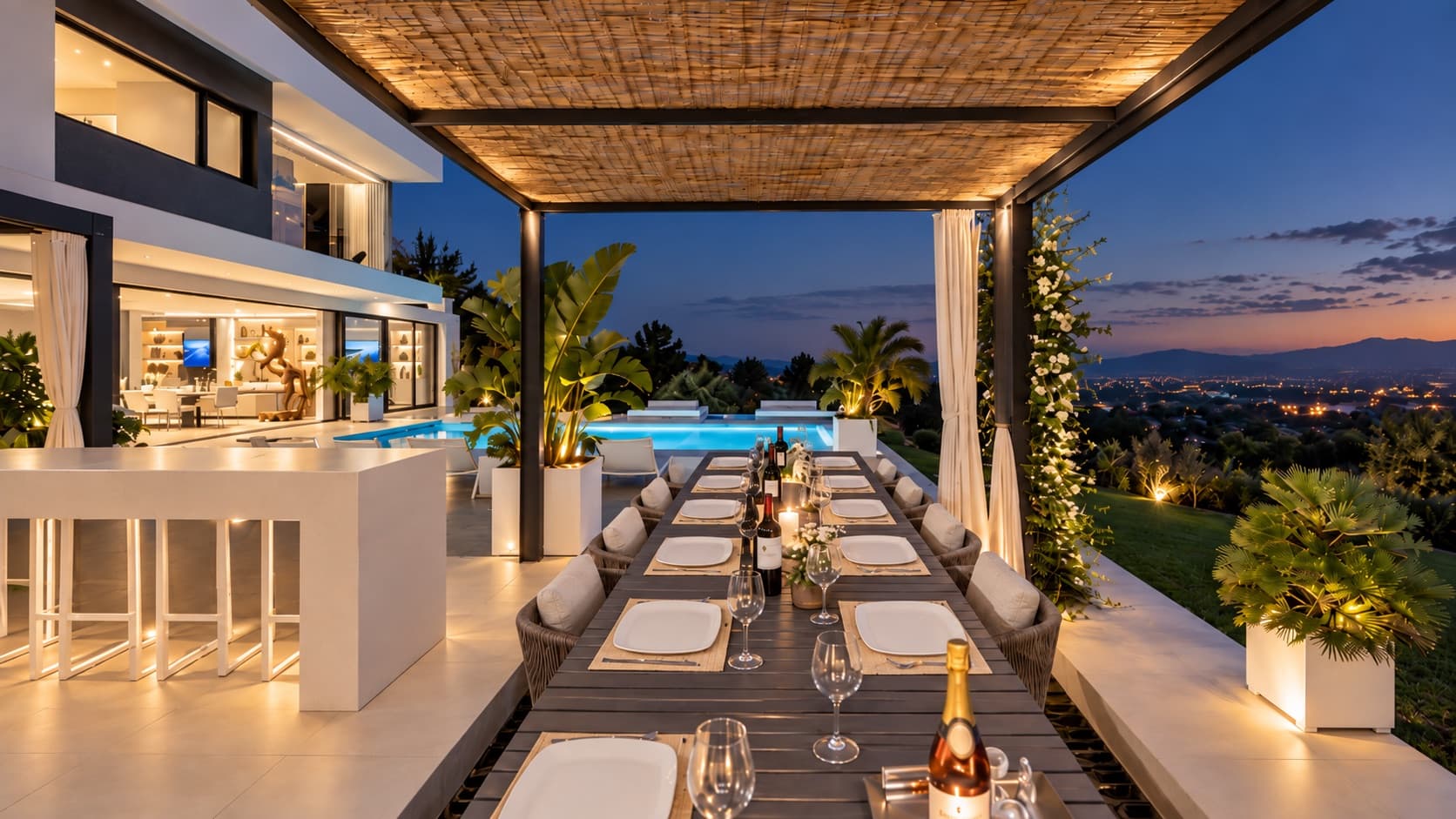 Long table under the outdoor pergola with the pool behind at dusk