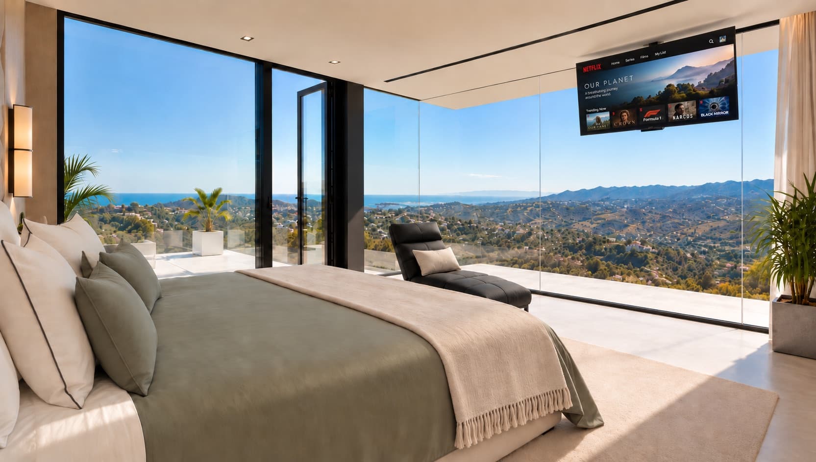 Main suite with natural light, bed and windows onto the mountains and the sea