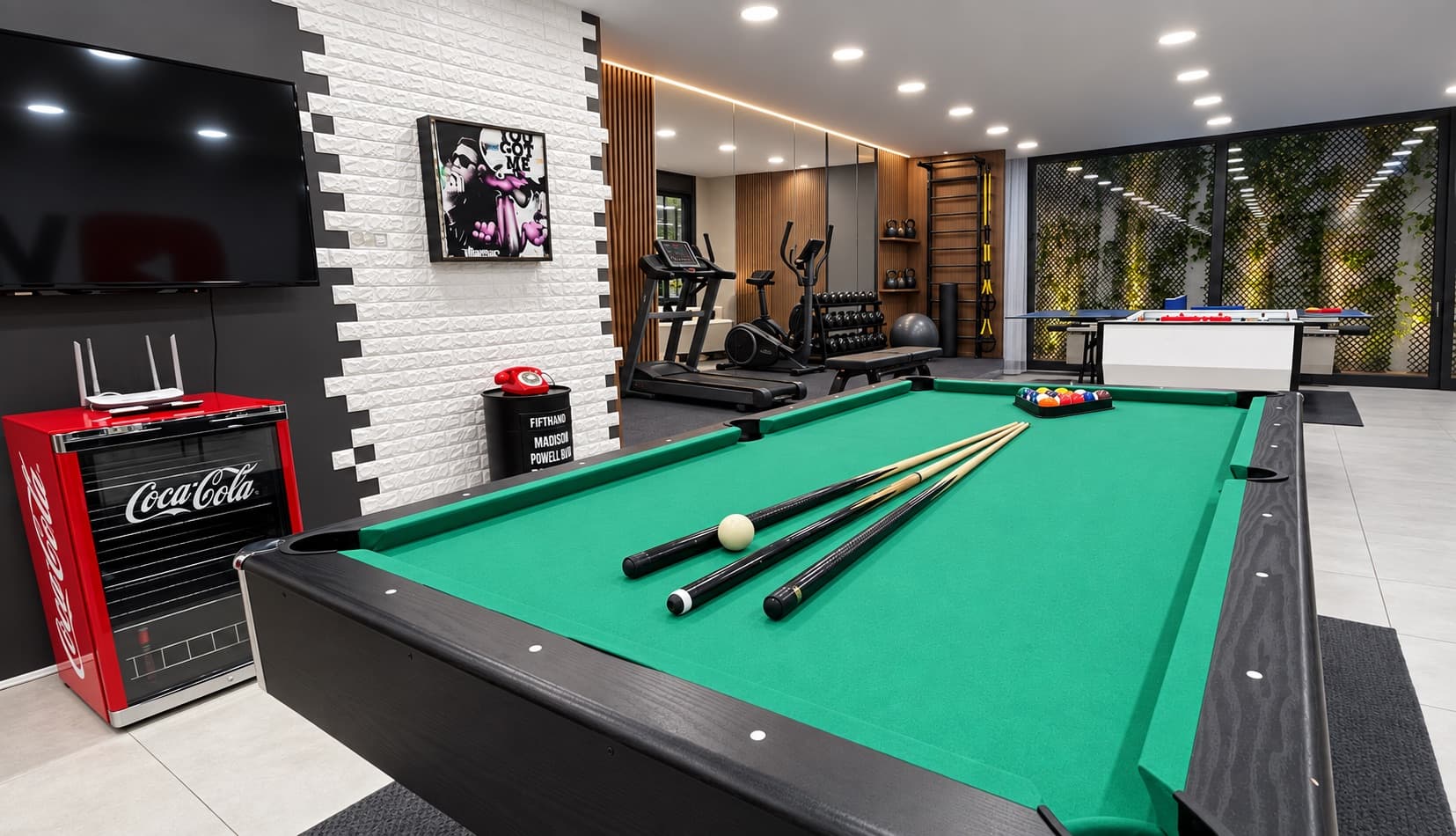 Games room with a billiard table and a wall mural