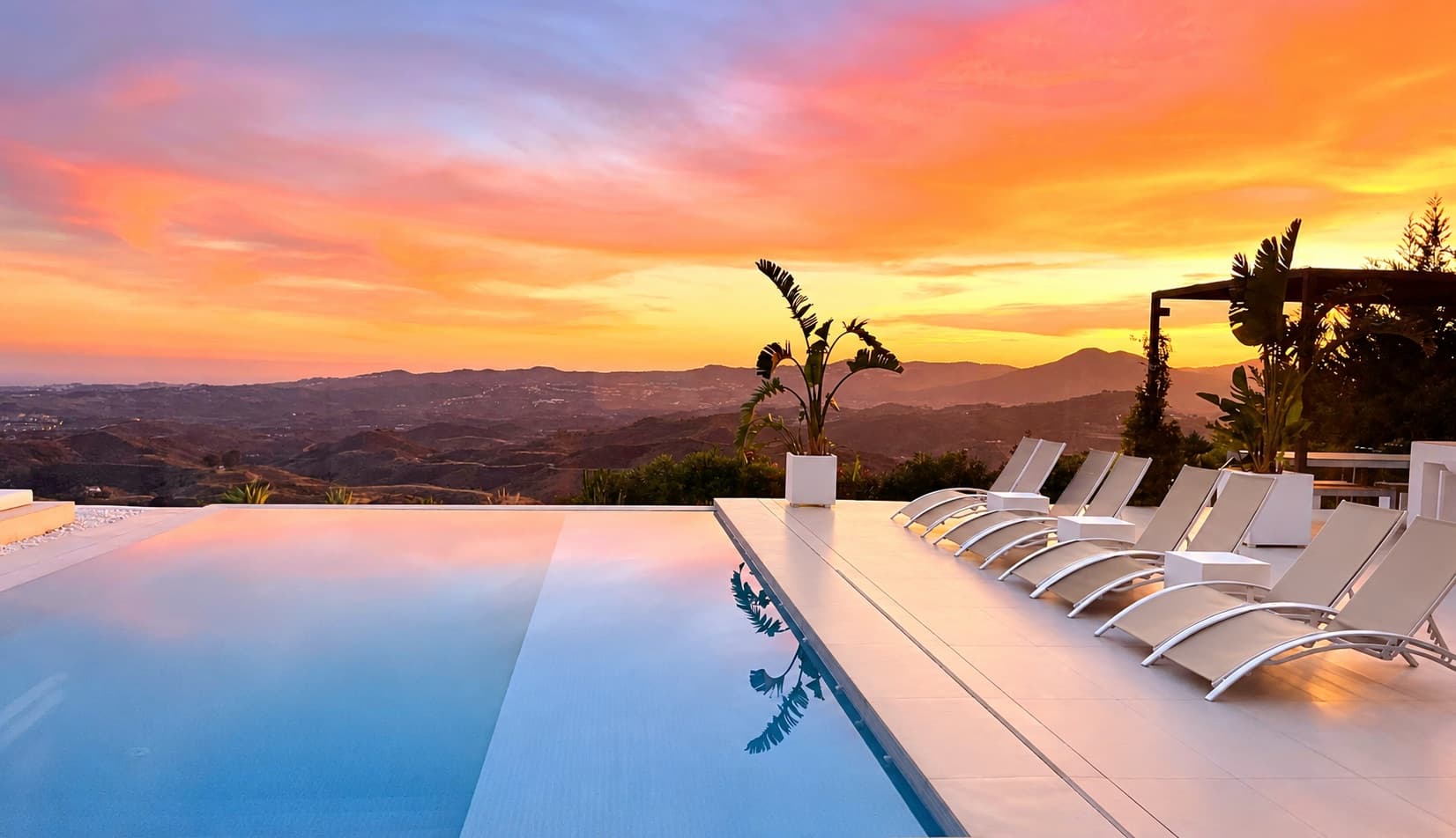 Infinity pool at sunset with panoramic views